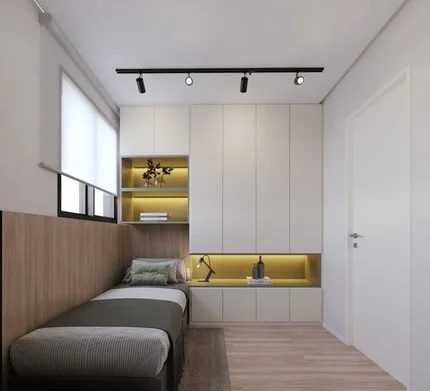 Quarto de solteiro decorado com cama de solteiro, mesa de estudo e armário embutido.